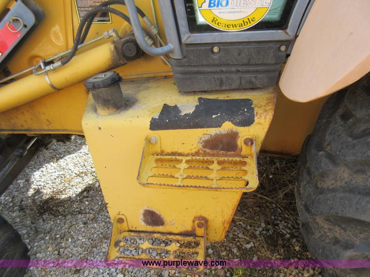 image for item K5253 1999 New Holland 675E backhoe
