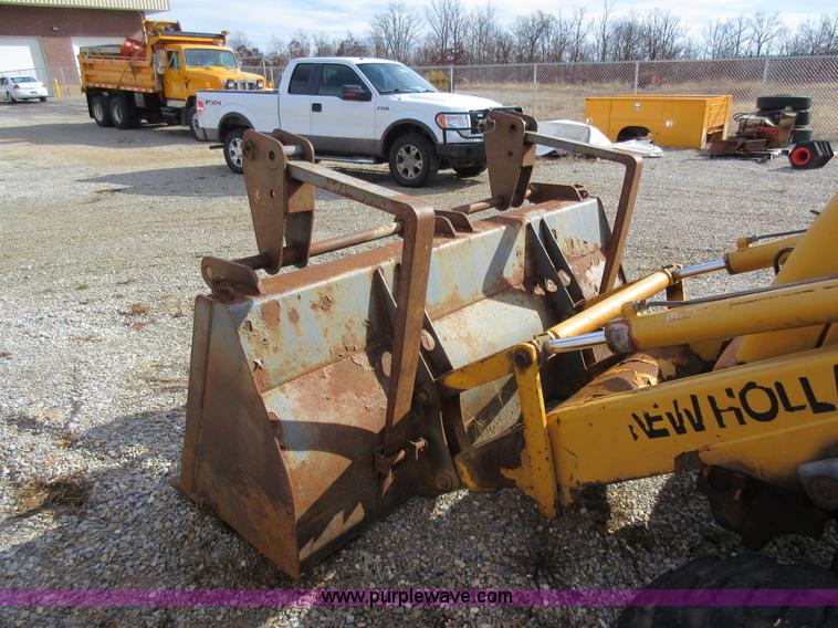 image for item K5253 1999 New Holland 675E backhoe