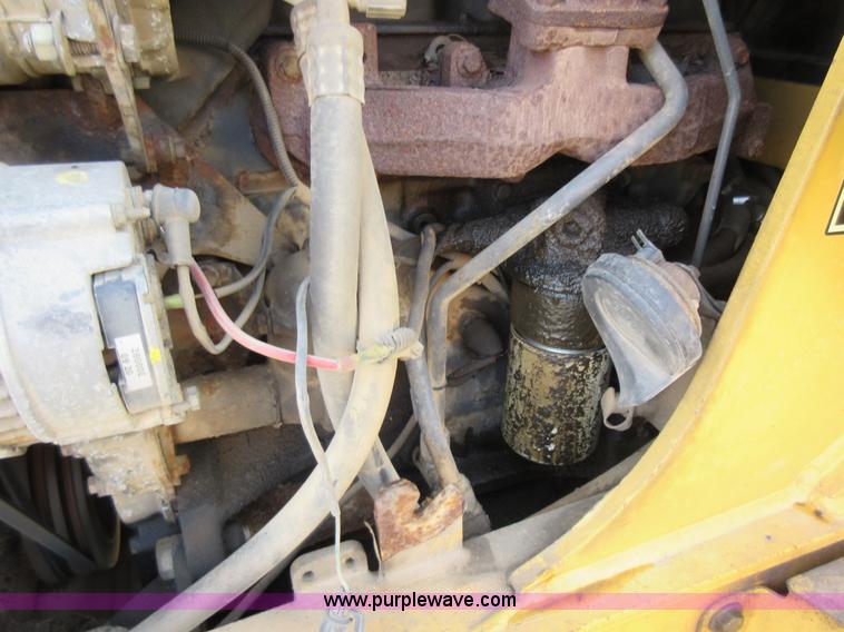 image for item K5253 1999 New Holland 675E backhoe