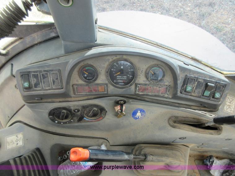 image for item K5253 1999 New Holland 675E backhoe