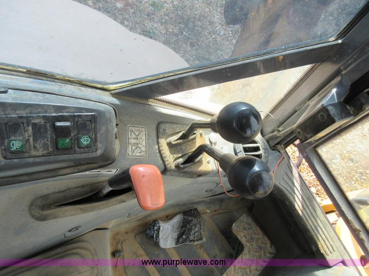 image for item K5253 1999 New Holland 675E backhoe