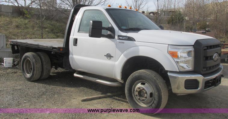 image for item L4165 2011 Ford F350 Super Duty XL flatbed pickup truck