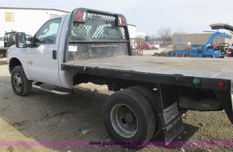 image for item L4165 2011 Ford F350 Super Duty XL flatbed pickup truck