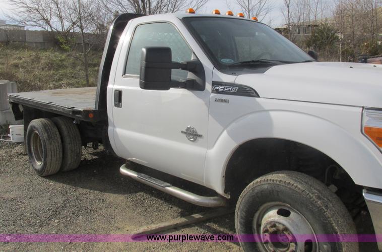 image for item L4165 2011 Ford F350 Super Duty XL flatbed pickup truck