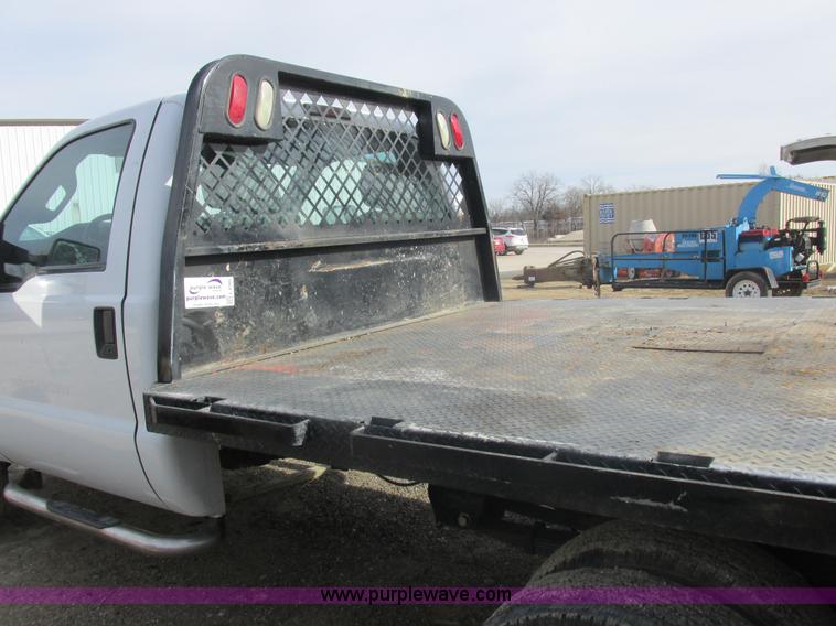 image for item L4165 2011 Ford F350 Super Duty XL flatbed pickup truck