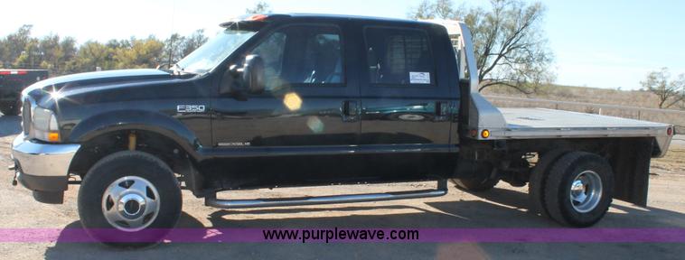 image for item L4473 2002 Ford F350 Lariat SuperCrew flatbed pickup truck