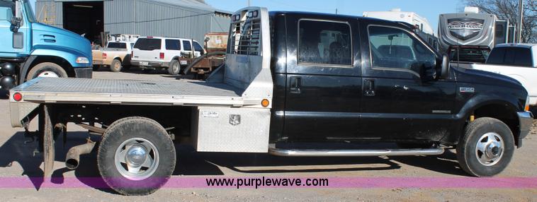 image for item L4473 2002 Ford F350 Lariat SuperCrew flatbed pickup truck