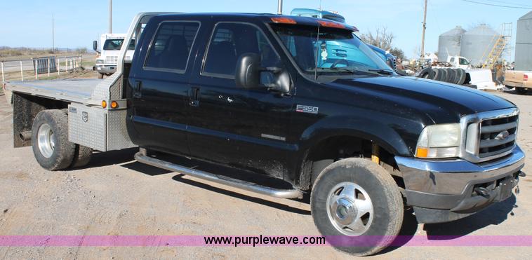 image for item L4473 2002 Ford F350 Lariat SuperCrew flatbed pickup truck