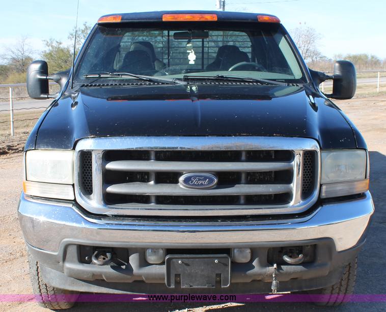 image for item L4473 2002 Ford F350 Lariat SuperCrew flatbed pickup truck
