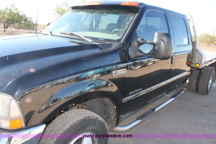 image for item L4473 2002 Ford F350 Lariat SuperCrew flatbed pickup truck