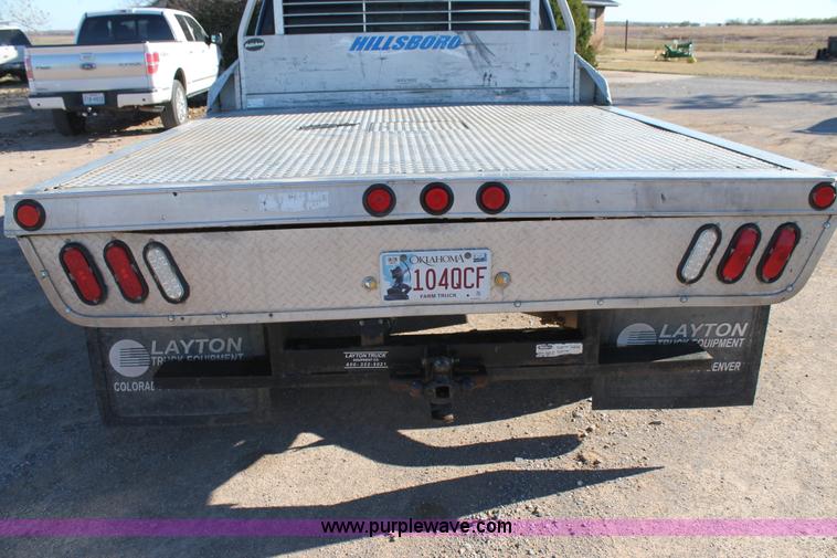 image for item L4473 2002 Ford F350 Lariat SuperCrew flatbed pickup truck