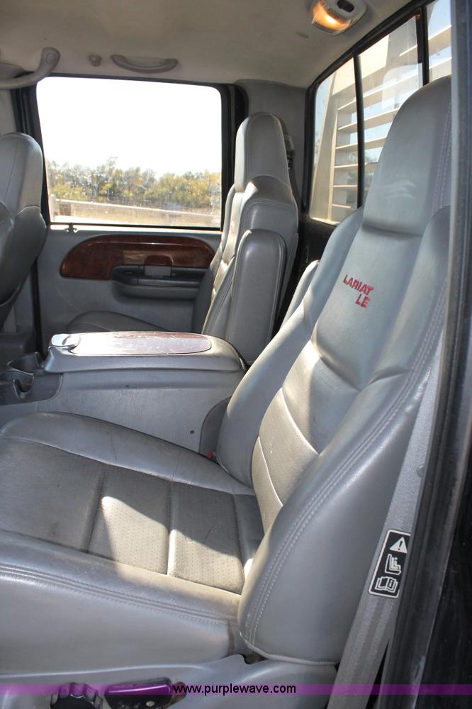 image for item L4473 2002 Ford F350 Lariat SuperCrew flatbed pickup truck