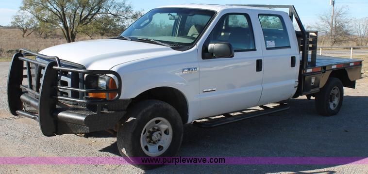 image for item L4474 2006 Ford F350 SuperCrew flatbed pickup truck