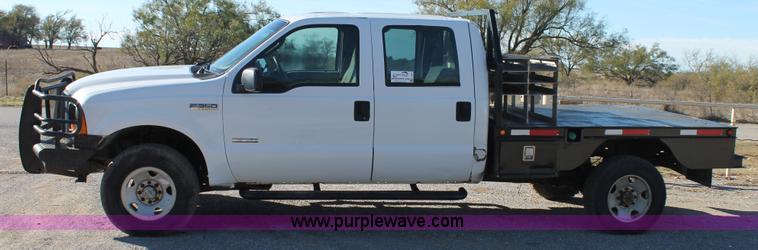 image for item L4474 2006 Ford F350 SuperCrew flatbed pickup truck