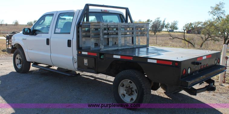 image for item L4474 2006 Ford F350 SuperCrew flatbed pickup truck