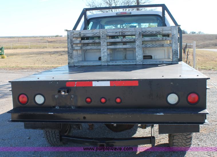 image for item L4474 2006 Ford F350 SuperCrew flatbed pickup truck
