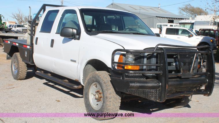 image for item L4474 2006 Ford F350 SuperCrew flatbed pickup truck