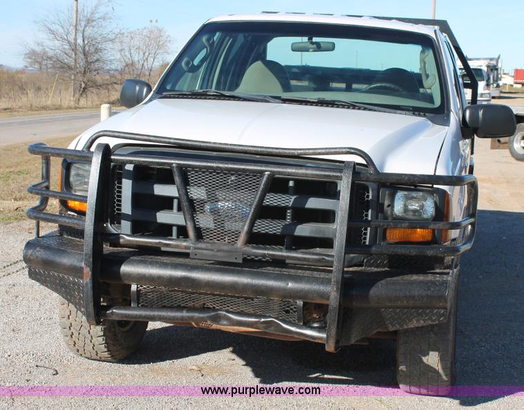 image for item L4474 2006 Ford F350 SuperCrew flatbed pickup truck