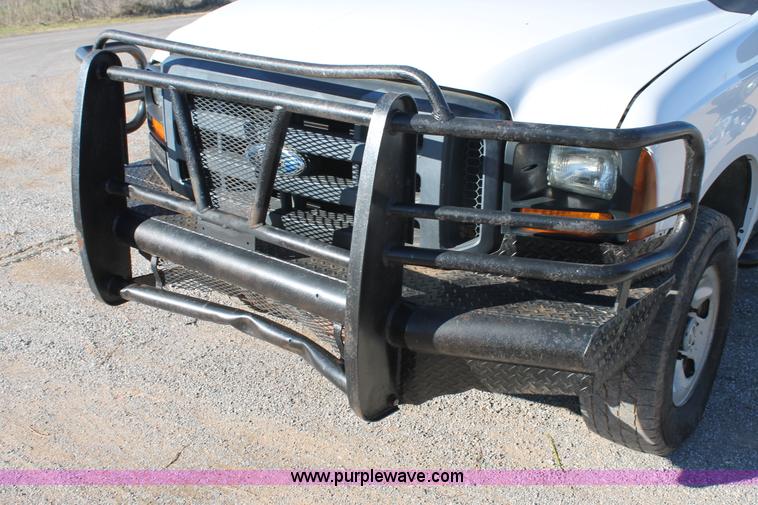 image for item L4474 2006 Ford F350 SuperCrew flatbed pickup truck