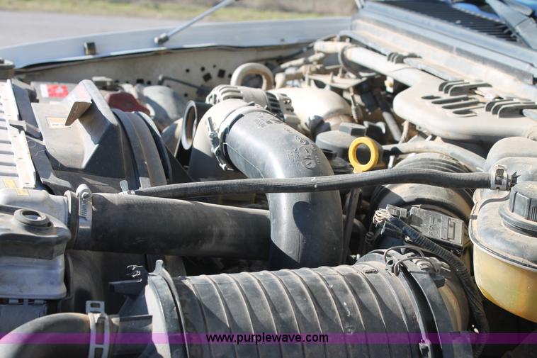 image for item L4474 2006 Ford F350 SuperCrew flatbed pickup truck