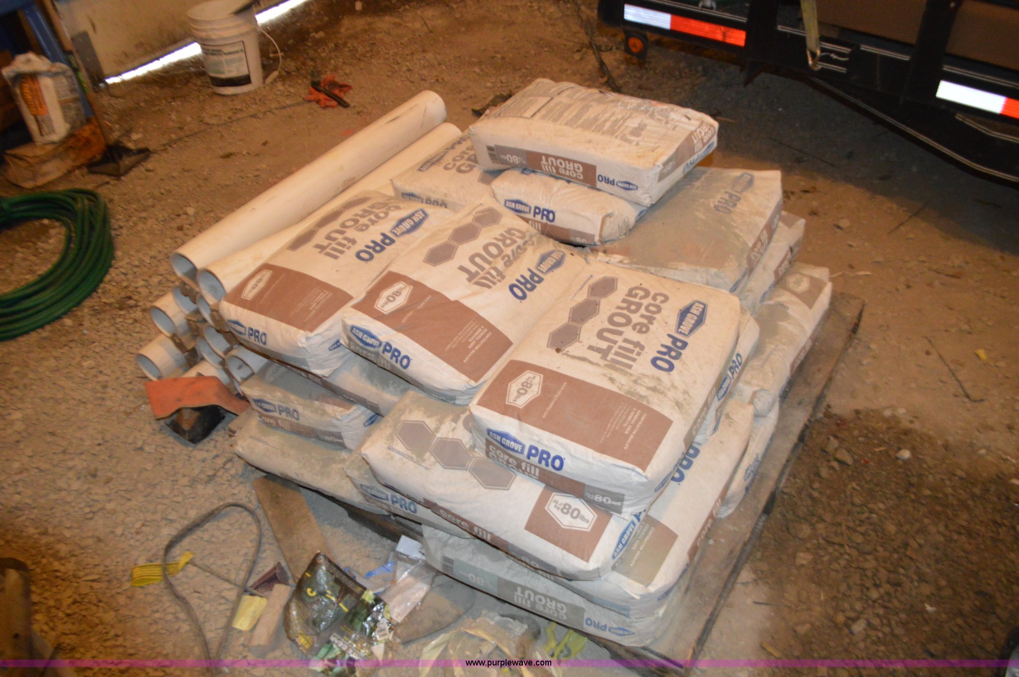Approximately 25 Ash Grove Pro core fill grout bags in Holden, MO
