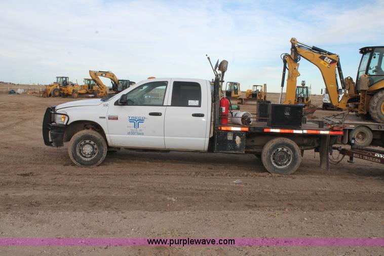 image for item J1342 2008 Dodge Ram 2500HD Quad Cab flatbed pickup truck