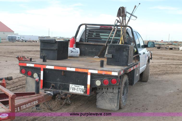 image for item J1342 2008 Dodge Ram 2500HD Quad Cab flatbed pickup truck