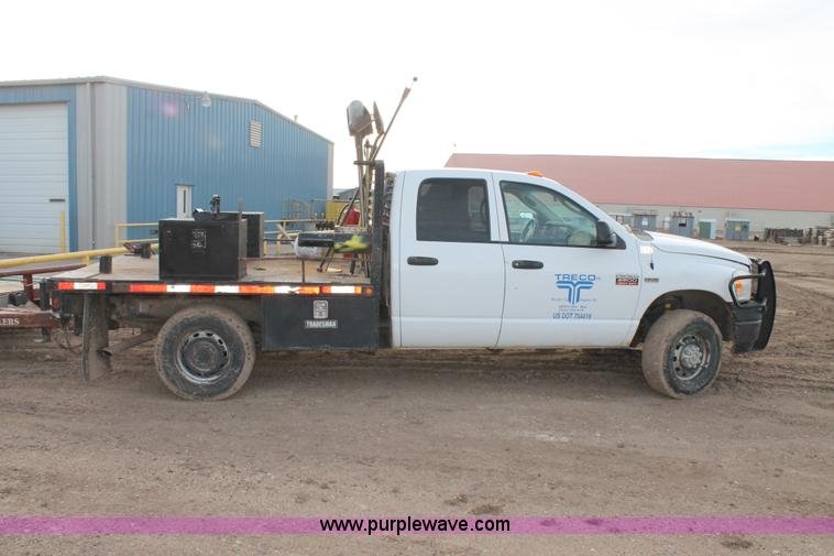 image for item J1342 2008 Dodge Ram 2500HD Quad Cab flatbed pickup truck
