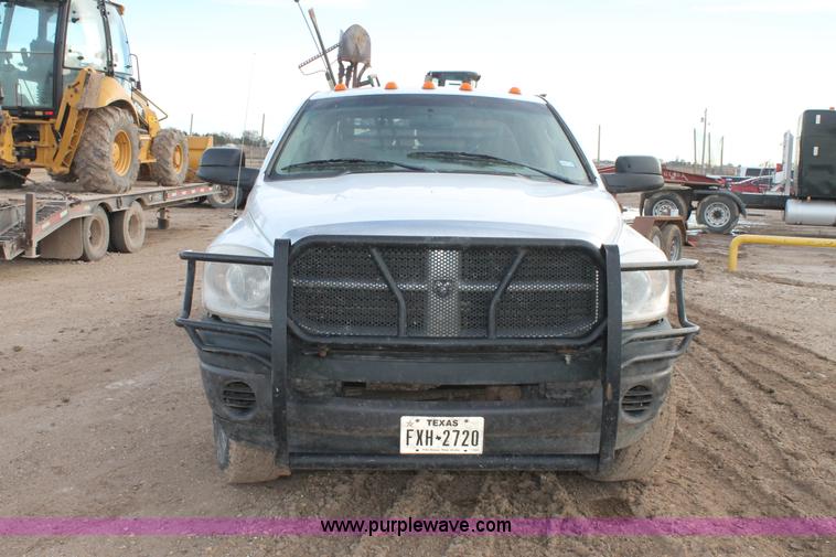 image for item J1342 2008 Dodge Ram 2500HD Quad Cab flatbed pickup truck