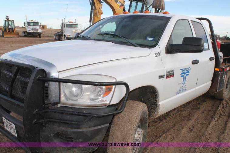 image for item J1342 2008 Dodge Ram 2500HD Quad Cab flatbed pickup truck
