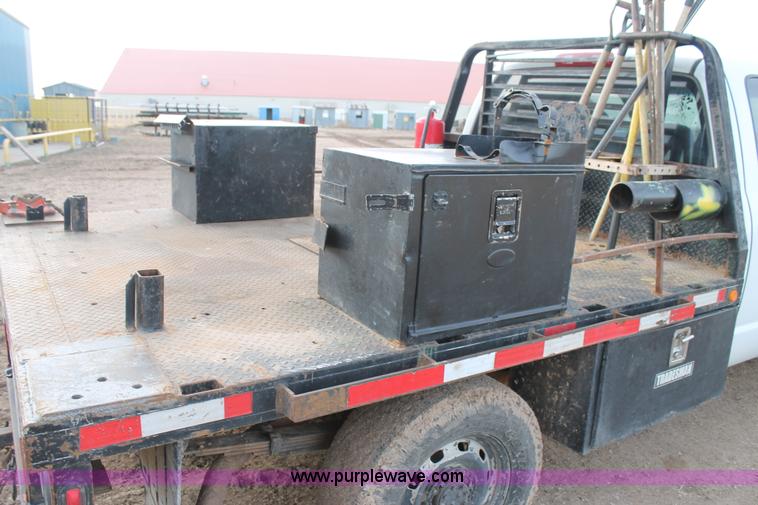 image for item J1342 2008 Dodge Ram 2500HD Quad Cab flatbed pickup truck