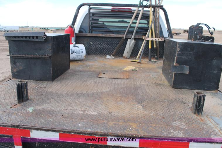 image for item J1342 2008 Dodge Ram 2500HD Quad Cab flatbed pickup truck