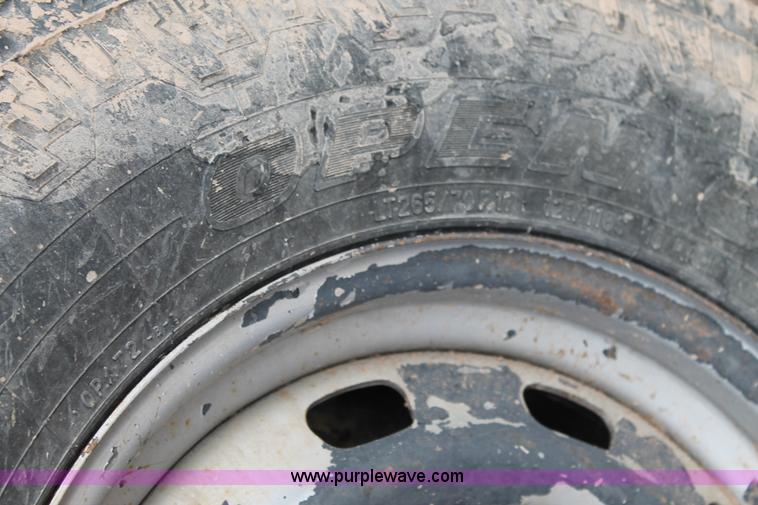 image for item J1342 2008 Dodge Ram 2500HD Quad Cab flatbed pickup truck