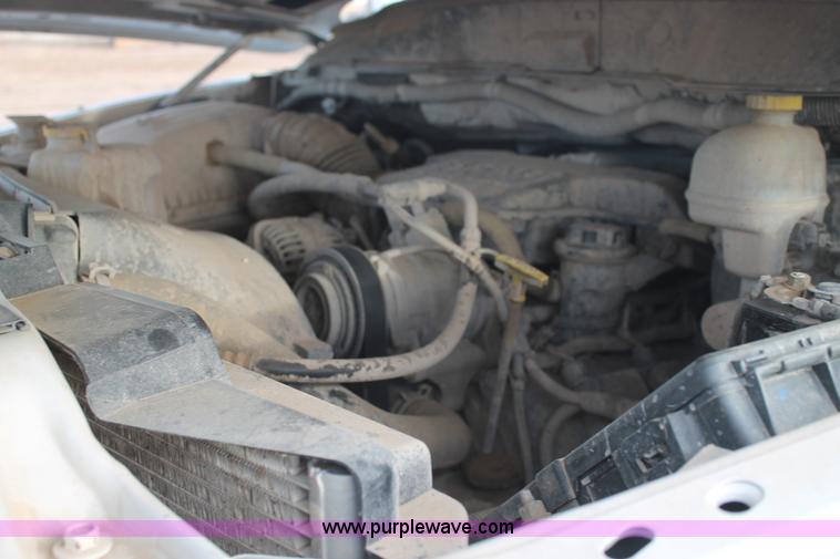 image for item J1342 2008 Dodge Ram 2500HD Quad Cab flatbed pickup truck