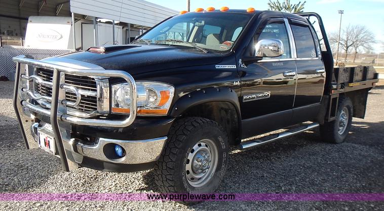 image for item L3583 2006 Dodge Ram 2500HD Quad Cab flatbed pickup truck