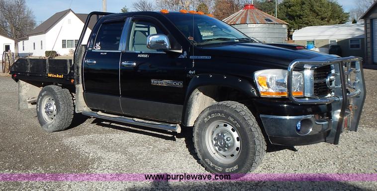 image for item L3583 2006 Dodge Ram 2500HD Quad Cab flatbed pickup truck