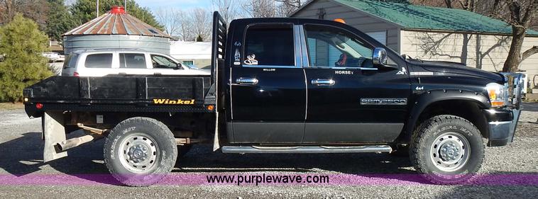 image for item L3583 2006 Dodge Ram 2500HD Quad Cab flatbed pickup truck