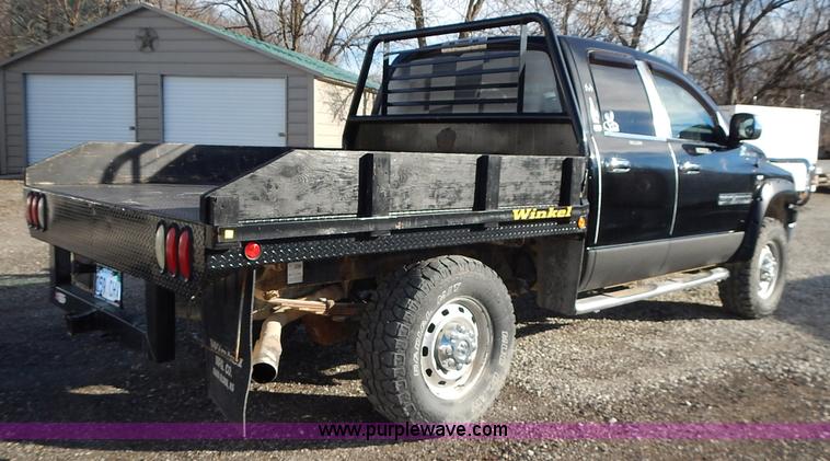 image for item L3583 2006 Dodge Ram 2500HD Quad Cab flatbed pickup truck