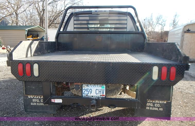 image for item L3583 2006 Dodge Ram 2500HD Quad Cab flatbed pickup truck