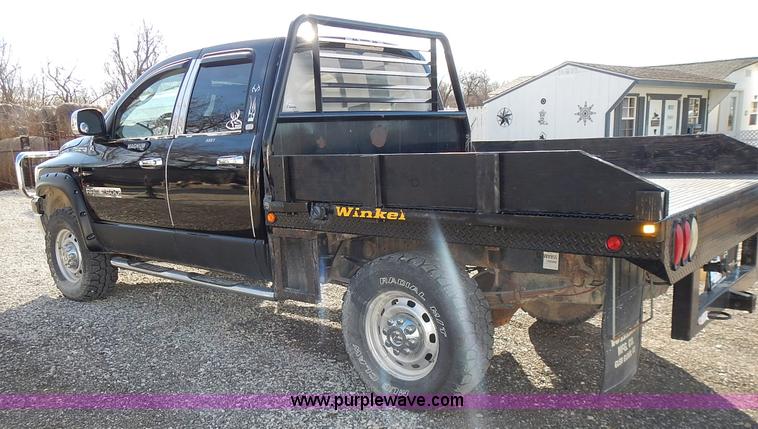 image for item L3583 2006 Dodge Ram 2500HD Quad Cab flatbed pickup truck