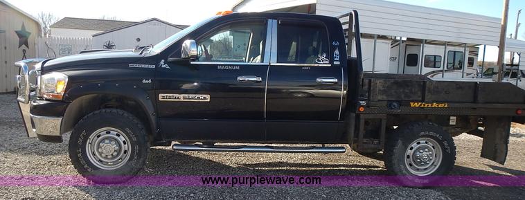 image for item L3583 2006 Dodge Ram 2500HD Quad Cab flatbed pickup truck