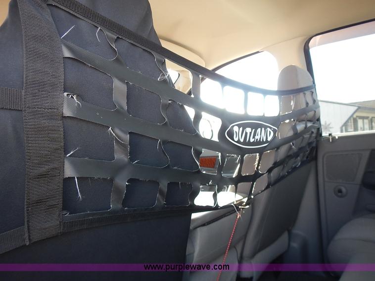 image for item L3583 2006 Dodge Ram 2500HD Quad Cab flatbed pickup truck