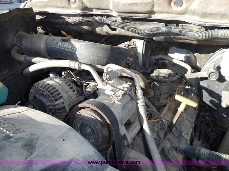 image for item L3583 2006 Dodge Ram 2500HD Quad Cab flatbed pickup truck