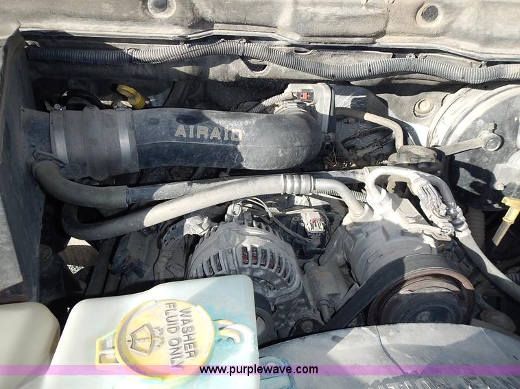 image for item L3583 2006 Dodge Ram 2500HD Quad Cab flatbed pickup truck