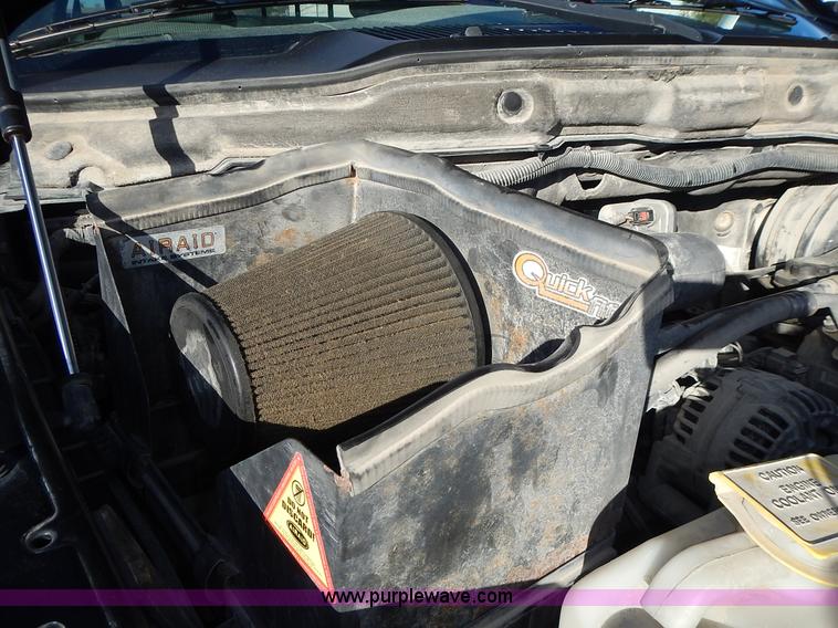 image for item L3583 2006 Dodge Ram 2500HD Quad Cab flatbed pickup truck