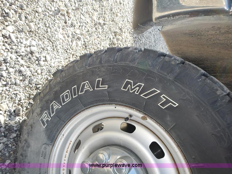 image for item L3583 2006 Dodge Ram 2500HD Quad Cab flatbed pickup truck