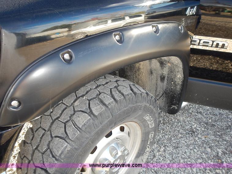 image for item L3583 2006 Dodge Ram 2500HD Quad Cab flatbed pickup truck