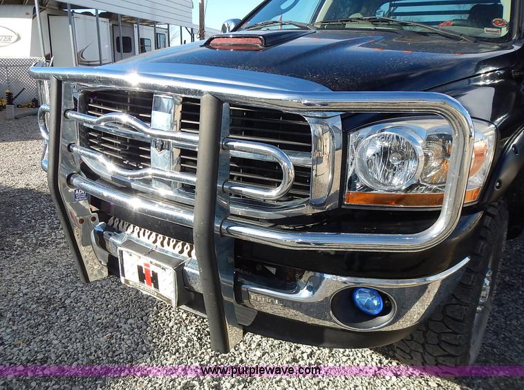 image for item L3583 2006 Dodge Ram 2500HD Quad Cab flatbed pickup truck