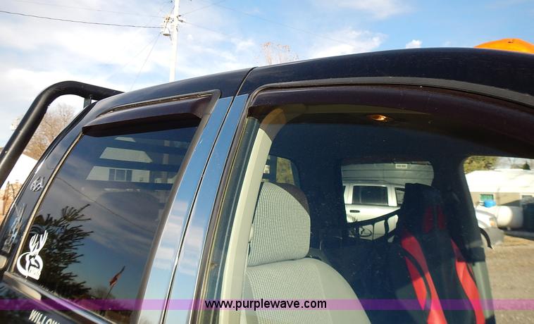 image for item L3583 2006 Dodge Ram 2500HD Quad Cab flatbed pickup truck