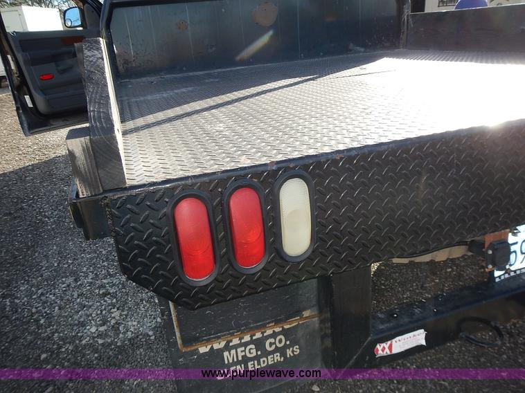 image for item L3583 2006 Dodge Ram 2500HD Quad Cab flatbed pickup truck